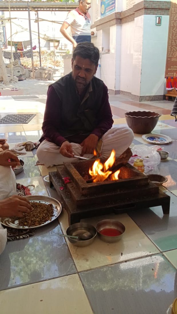Havan fire being performed in a temple courtyard
